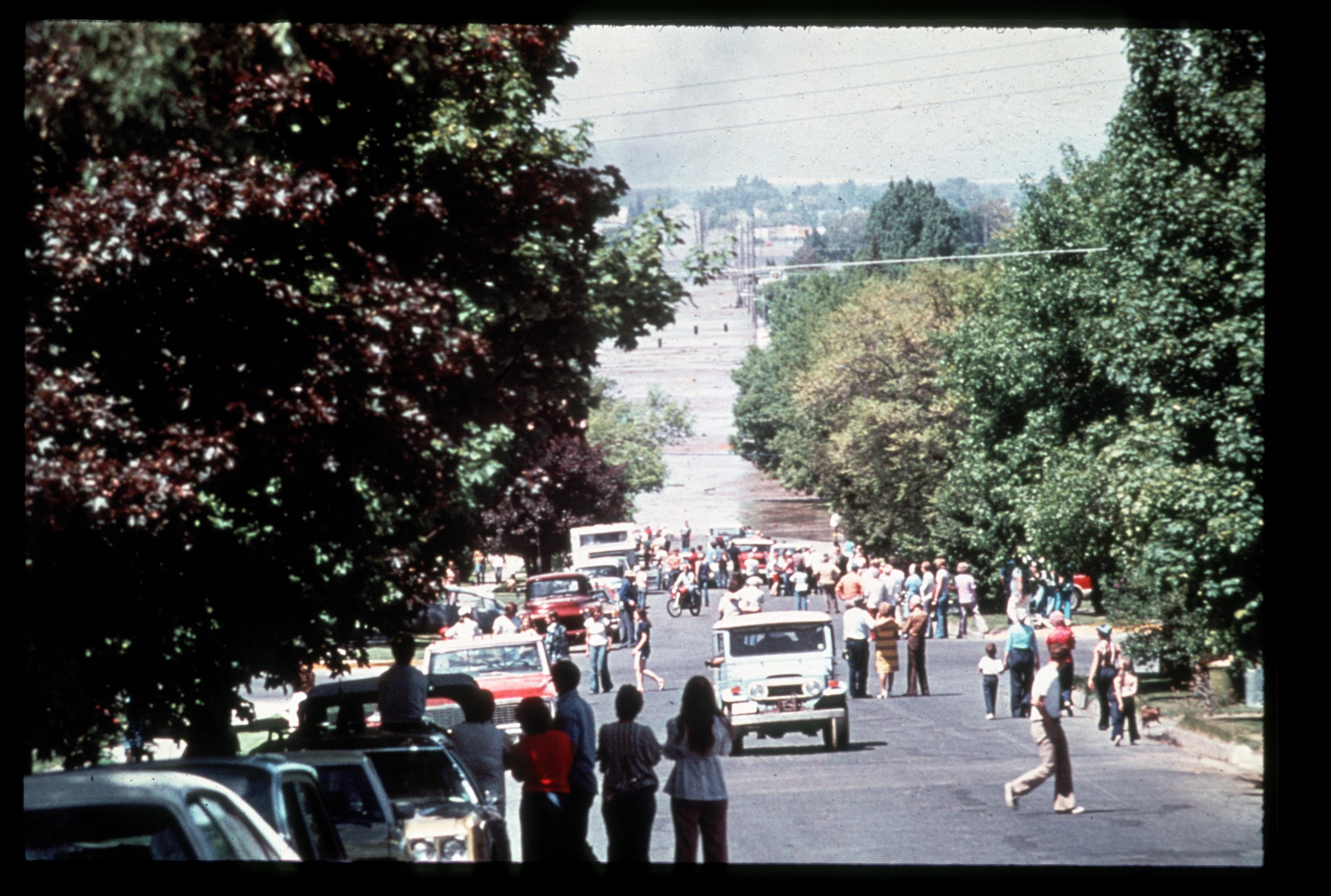 Onlookers watching the Teton Dam failure inundation move through Rexburg, ID.