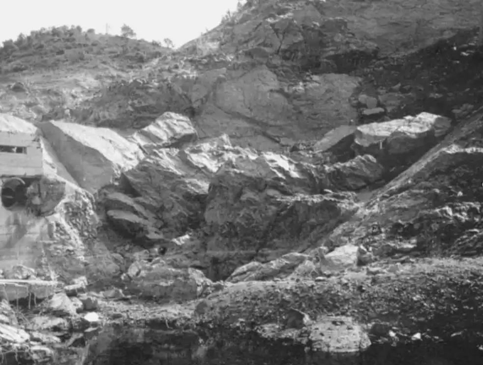 Remnants of left abutment and upstream/downstream fault lines; view from downstream.