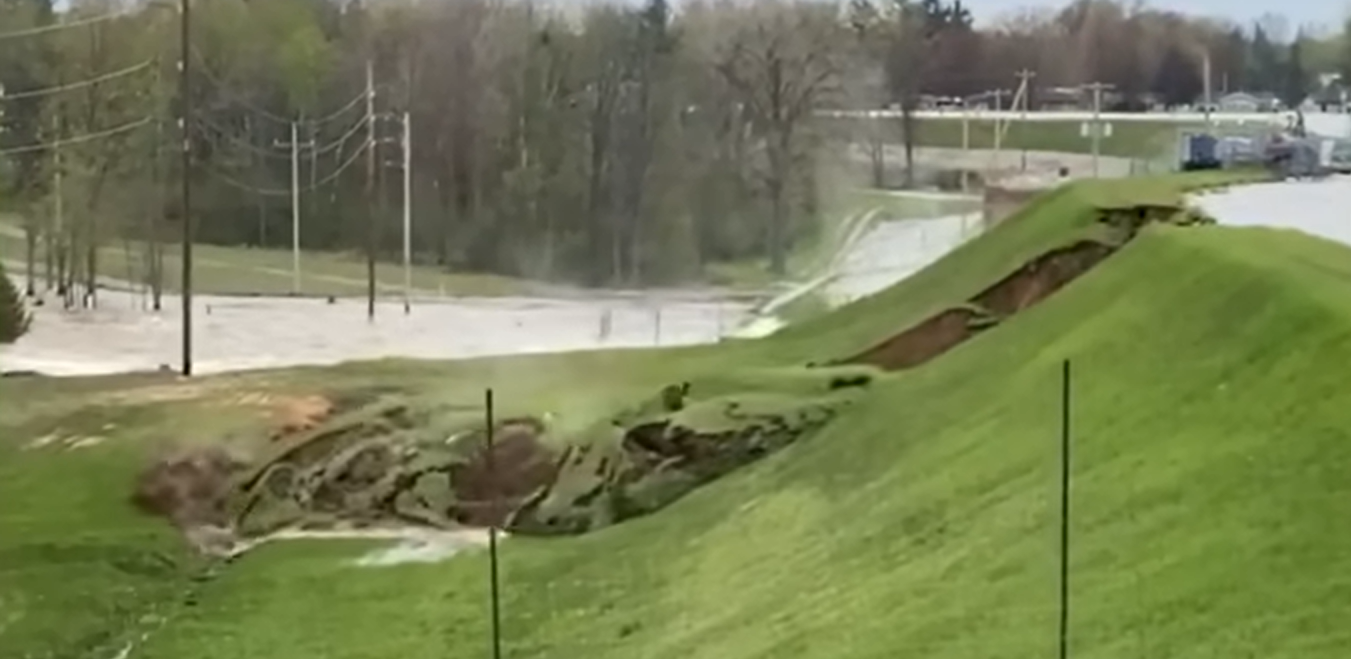 Still image of Edenville Dam failure video.